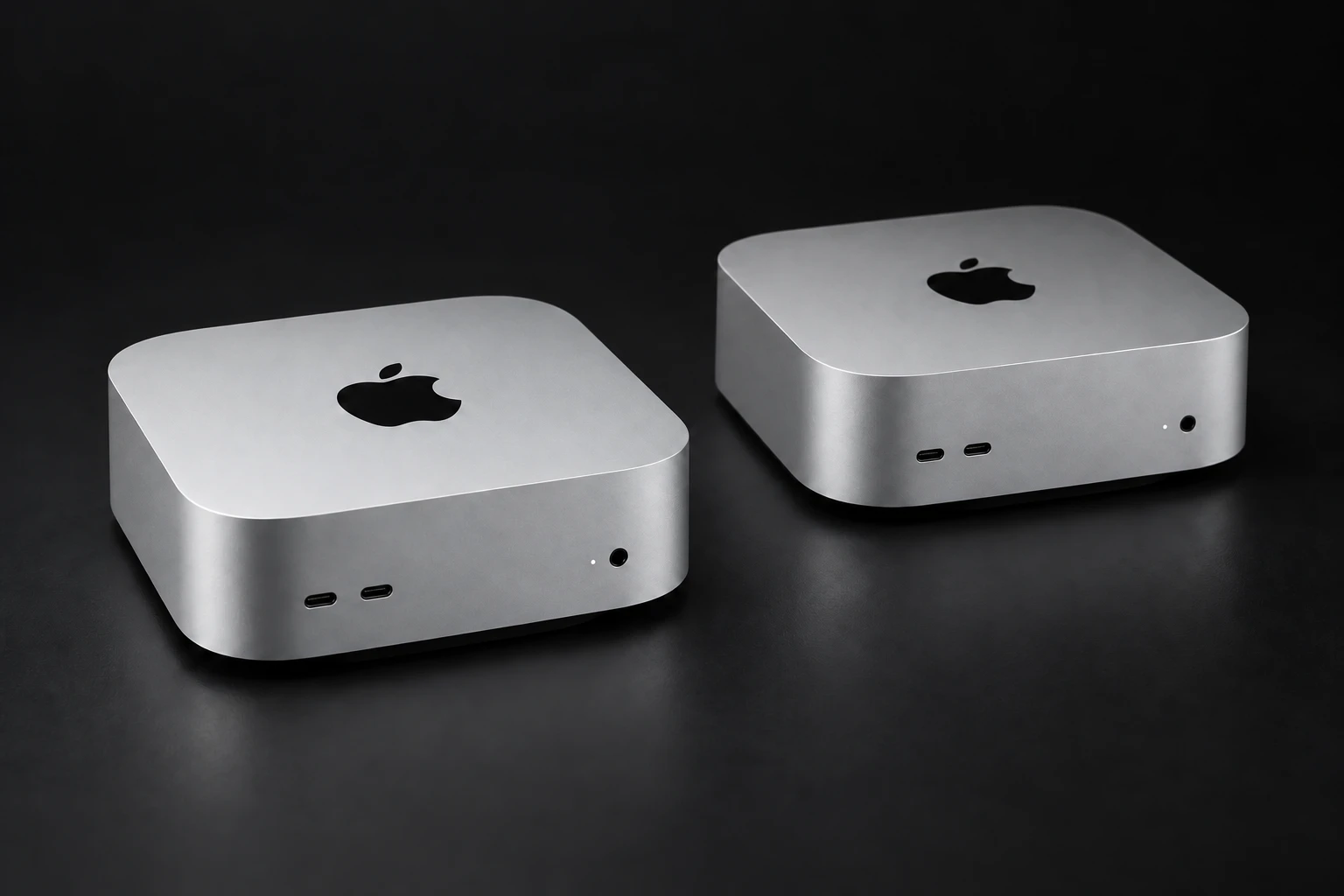 Photorealistic visualization of two silver Apple Mac mini computers with front USB-C ports